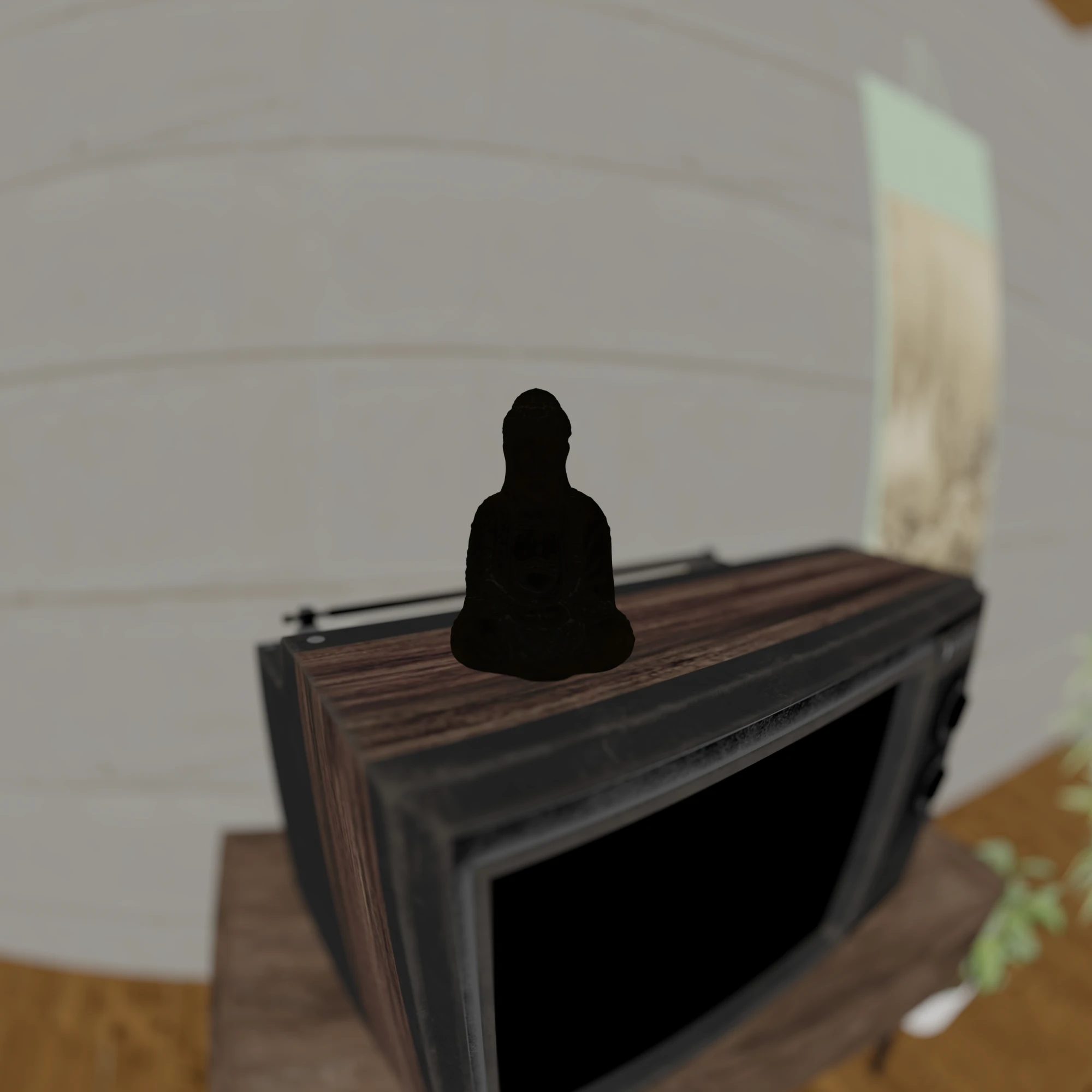 Color pass: the Buddha on the television in flat surface colors with no lighting; the bronze figure is black