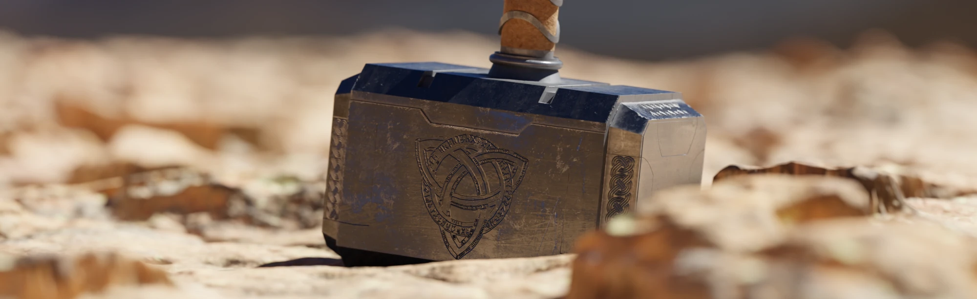 Mjölnir on sunlit desert rock, the engraved knot facing the camera