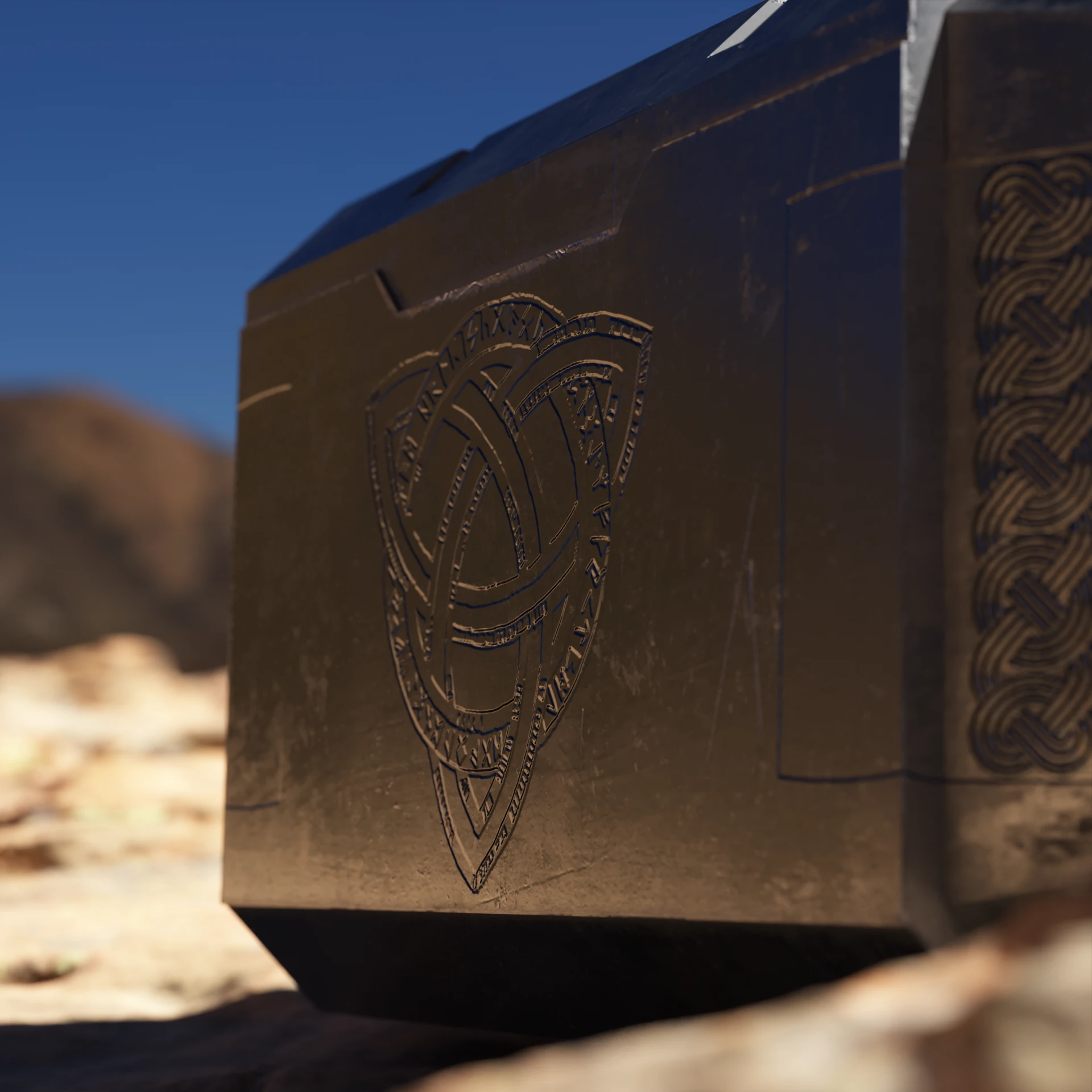 Close-up of the engraved knot and runes on the hammer’s face, with braided knotwork along its edge