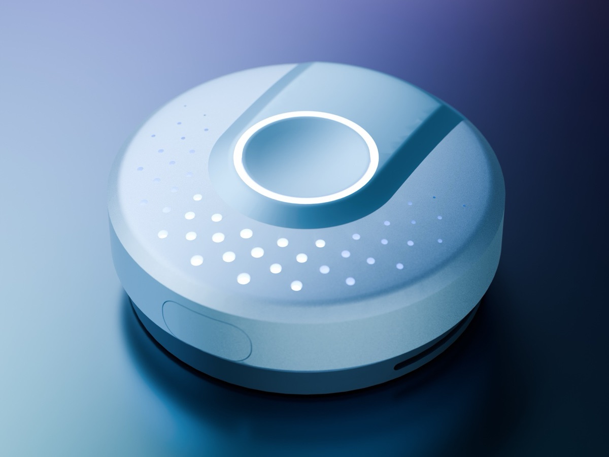 A round, pale blue sensor module with a glowing ring on top and rows of speaker holes
