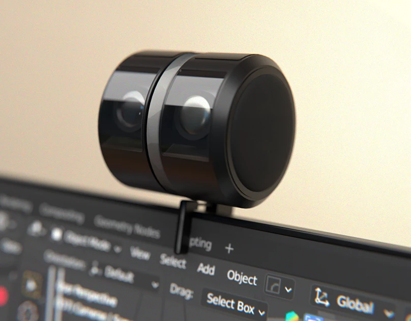 Render of Waveform, a compact black cylindrical device mounted on top of a computer monitor